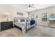 Main bedroom with a metal framed bed, dresser, and plenty of natural light at 4541 Girvan Dr. # 27-D, Myrtle Beach, SC 29579