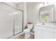 Bathroom with a shower, toilet, and white vanity with a large mirror at 4541 Girvan Dr. # 27-D, Myrtle Beach, SC 29579