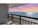 Balcony view of the ocean at sunset with beach and sand visible at 1501 S Ocean Blvd. # 1040, Myrtle Beach, SC 29577