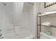 Bathroom with shower, shelves, and fresh towels at 1501 S Ocean Blvd. # 1040, Myrtle Beach, SC 29577