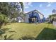 Elevated home with spacious backyard, detached shed, and covered patio area at 405 N 30Th Ave. N, North Myrtle Beach, SC 29582