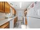 Efficient galley-style kitchen features wood cabinets, and includes a dishwasher at 405 N 30Th Ave. N, North Myrtle Beach, SC 29582