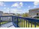 Elevated deck with blue railing offering backyard and neighborhood views at 405 N 30Th Ave. N, North Myrtle Beach, SC 29582