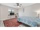 Bedroom with a dresser, TV, and ceiling fan, plus access to bathroom at 405 N 30Th Ave. N, North Myrtle Beach, SC 29582