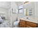 Small bathroom with toilet, sink, and shower at 405 N 30Th Ave. N, North Myrtle Beach, SC 29582