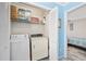 Small laundry closet with washer and dryer, and additional shelving at 405 N 30Th Ave. N, North Myrtle Beach, SC 29582