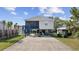 Elevated beach house with a screened porch and parking at 405 N 30Th Ave. N, North Myrtle Beach, SC 29582