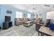 Light and airy living room with light blue walls and comfortable seating at 405 N 30Th Ave. N, North Myrtle Beach, SC 29582