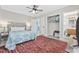Main bedroom with a queen bed, access to bathroom, and ceiling fan at 405 N 30Th Ave. N, North Myrtle Beach, SC 29582