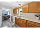 Open kitchen with view into dining area, offering wood cabinets and modern appliances at 405 N 30Th Ave. N, North Myrtle Beach, SC 29582
