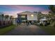Elevated home with carport and outdoor seating area at 405 N 30Th Ave. N, North Myrtle Beach, SC 29582