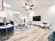 Spacious living room with hardwood floors, a TV, and comfortable seating at 230 Mint Ct., Little River, SC 29566