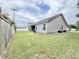 Gray house exterior with backyard and wooden fence at 230 Mint Ct., Little River, SC 29566