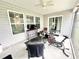 Relaxing screened porch with seating and exercise bike at 230 Mint Ct., Little River, SC 29566