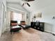 Relaxing bedroom with two chaise lounges and a ceiling fan at 230 Mint Ct., Little River, SC 29566