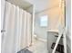 Clean bathroom with shower/tub combo, vanity, and tile flooring at 230 Mint Ct., Little River, SC 29566