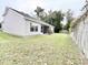 Gray house exterior with screened porch and grassy yard at 230 Mint Ct., Little River, SC 29566