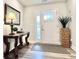 Entryway with a console table, mirror, and potted plant at 230 Mint Ct., Little River, SC 29566