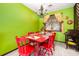 Bright dining area with red table and chairs, pineapple chandelier at 3015 Old Bryan Dr. # 4-8, Myrtle Beach, SC 29577