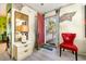 Bright entryway with red door, mirror, and red chair at 3015 Old Bryan Dr. # 4-8, Myrtle Beach, SC 29577
