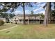 Back of two story building with balconies and grassy area at 3015 Old Bryan Dr. # 4-8, Myrtle Beach, SC 29577