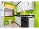 Small kitchen with white cabinets and green walls at 3015 Old Bryan Dr. # 4-8, Myrtle Beach, SC 29577