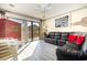 Living room with black leather sectional sofa and access to deck at 3015 Old Bryan Dr. # 4-8, Myrtle Beach, SC 29577