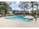 Community pool with lounge chairs, surrounded by landscaping and residential buildings at 3015 Old Bryan Dr. # 4-8, Myrtle Beach, SC 29577