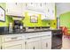 Bright kitchen features white cabinets, black countertops, and modern appliances at 3015 Old Bryan Dr. # 4-8, Myrtle Beach, SC 29577