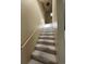 Carpeted staircase leading to the upper level of the home at 704 43Rd Ave. S, North Myrtle Beach, SC 29582