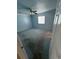 Spacious bedroom with light blue walls and ceiling fan at 704 43Rd Ave. S, North Myrtle Beach, SC 29582