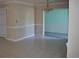 Bright dining room with tile floors and kitchen access at 704 43Rd Ave. S, North Myrtle Beach, SC 29582