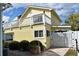 Yellow house with deck and white fence at 704 43Rd Ave. S, North Myrtle Beach, SC 29582