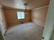 Spacious bedroom with a chandelier and window coverings at 704 43Rd Ave. S, North Myrtle Beach, SC 29582
