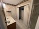 Bathroom with shower, vanity, and linen closet at 704 43Rd Ave. S, North Myrtle Beach, SC 29582
