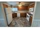 Galley kitchen with appliances and wood cabinets at 704 43Rd Ave. S, North Myrtle Beach, SC 29582