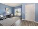 Cozy living room with blue walls, hardwood floors, and two armchairs at 5700 Redgum Dr., Myrtle Beach, SC 29579
