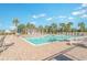 Relaxing community pool with lounge chairs and a pergola at 5700 Redgum Dr., Myrtle Beach, SC 29579