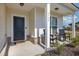 Inviting front porch with rocking chairs and landscaping at 5700 Redgum Dr., Myrtle Beach, SC 29579