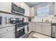 Modern kitchen with stainless steel appliances and granite countertops at 5700 Redgum Dr., Myrtle Beach, SC 29579