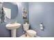 Small bathroom with pedestal sink and toilet at 5700 Redgum Dr., Myrtle Beach, SC 29579