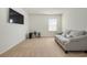 Bright bonus room featuring a comfortable couch and large TV at 5700 Redgum Dr., Myrtle Beach, SC 29579