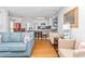 Open living room featuring hardwood floors and kitchen access at 1101 Possum Trot Rd. # C205, North Myrtle Beach, SC 29582