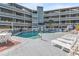 Inviting pool area with lounge chairs and tables, perfect for relaxation at 1101 Possum Trot Rd. # C205, North Myrtle Beach, SC 29582