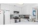 Well-equipped kitchen featuring stainless steel appliances and white cabinetry at 1101 Possum Trot Rd. # C205, North Myrtle Beach, SC 29582
