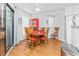 Cozy dining area featuring a round wooden table and four chairs at 1101 Possum Trot Rd. # C205, North Myrtle Beach, SC 29582