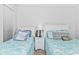 Bedroom with two twin beds and coastal decor at 1101 Possum Trot Rd. # C205, North Myrtle Beach, SC 29582