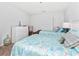 Bedroom with two twin beds, dresser, and coastal decor at 1101 Possum Trot Rd. # C205, North Myrtle Beach, SC 29582