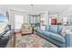 Spacious living room with hardwood floors, comfortable seating and a view at 1101 Possum Trot Rd. # C205, North Myrtle Beach, SC 29582