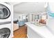 Open kitchen features a breakfast bar and views into the living room at 1101 Possum Trot Rd. # C205, North Myrtle Beach, SC 29582